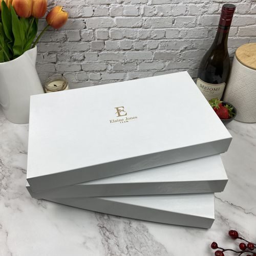 Realtor logo engraved on gift boxes.