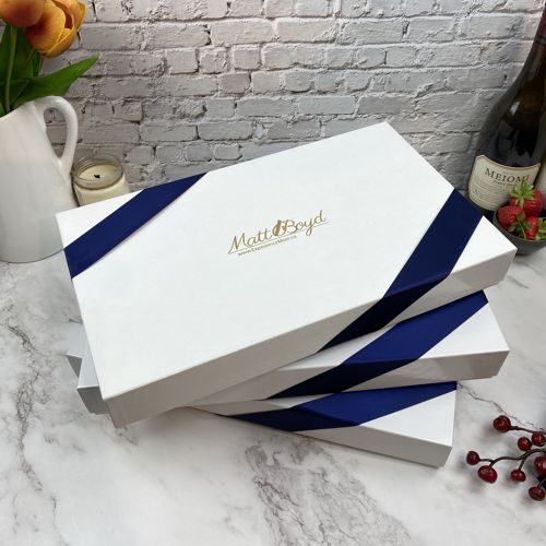 Realtor logo on gift boxes with ribbon.