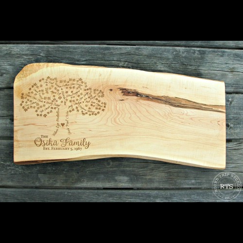 Live edge board with no bark and an engraved family tree.