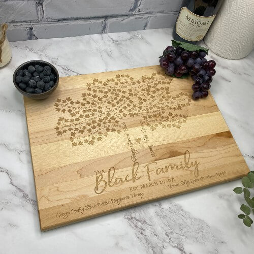 The best wedding anniversary gift for parents - a cutting board with their family tree engraved.