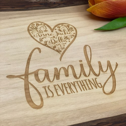 Engrave gifts, made in Canada. This custom charcuterie board has "family is everything" engraved. There is also a heart filled with the names of the family.