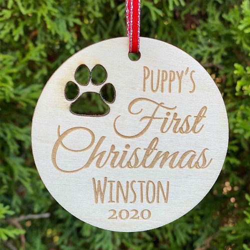 Birch Ply Ornament with cut out paw print and "puppy's first Christmas" engraved.