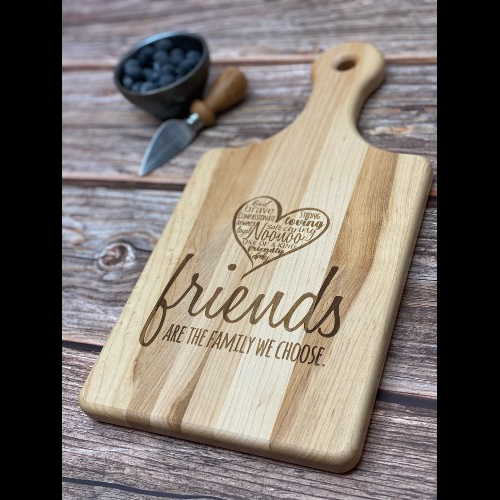 Engraved cutting board with an engraving celebrating friendship.