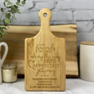 Custom engraved cutting board with a saying for friends and a personal note engraved in Croatian.