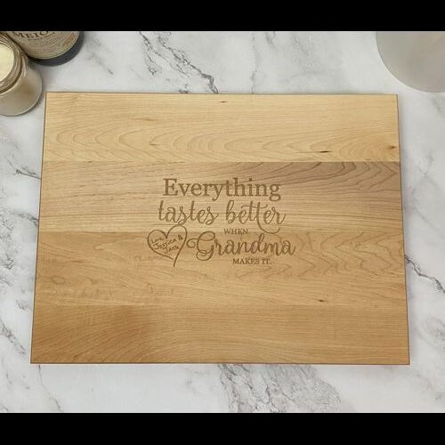 Rectangular cutting board with "everything tastes better when Grandma makes it."