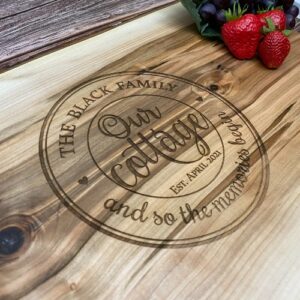 Gifts for cottage owners - a custom charcuterie board engraved with a popular cottage design.