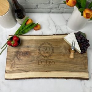 Anniversary design engraved on a large charcuterie board.