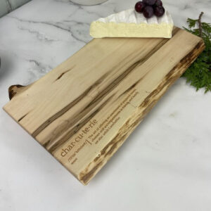 Charcuterie board on sale with engraving in the corner.