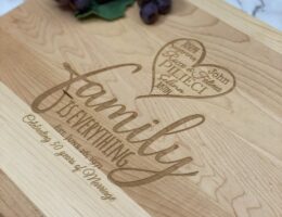 Engraved cutting board with family is everything and the names of the family members in the heart.