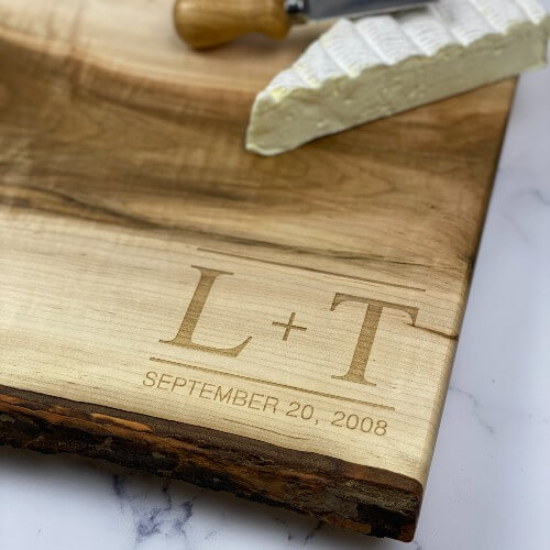 Wood serving board with initial and date engraved in the corner makes a unique wedding gift.
