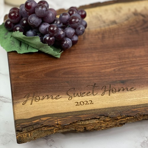 Home sweet home and move in date engraved on charcuterie boards ready to deliver.
