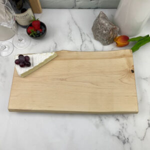 A maple charcuterie board waiting for personalized engraving.