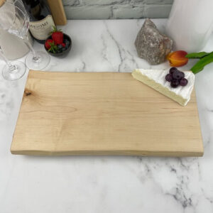 Maple charcuterie board can be engraved in the center or the corners.
