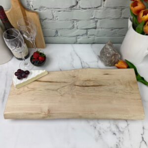 A maple charcuterie board before engraving.